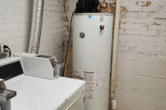 Open water heater in Laundry Room (Code Violation)